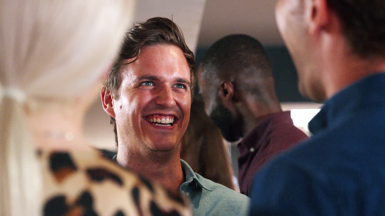 Close Up Of Young Friends Meeting For Drinks In Bar