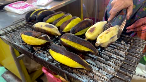 bananas being grilled at a floating market