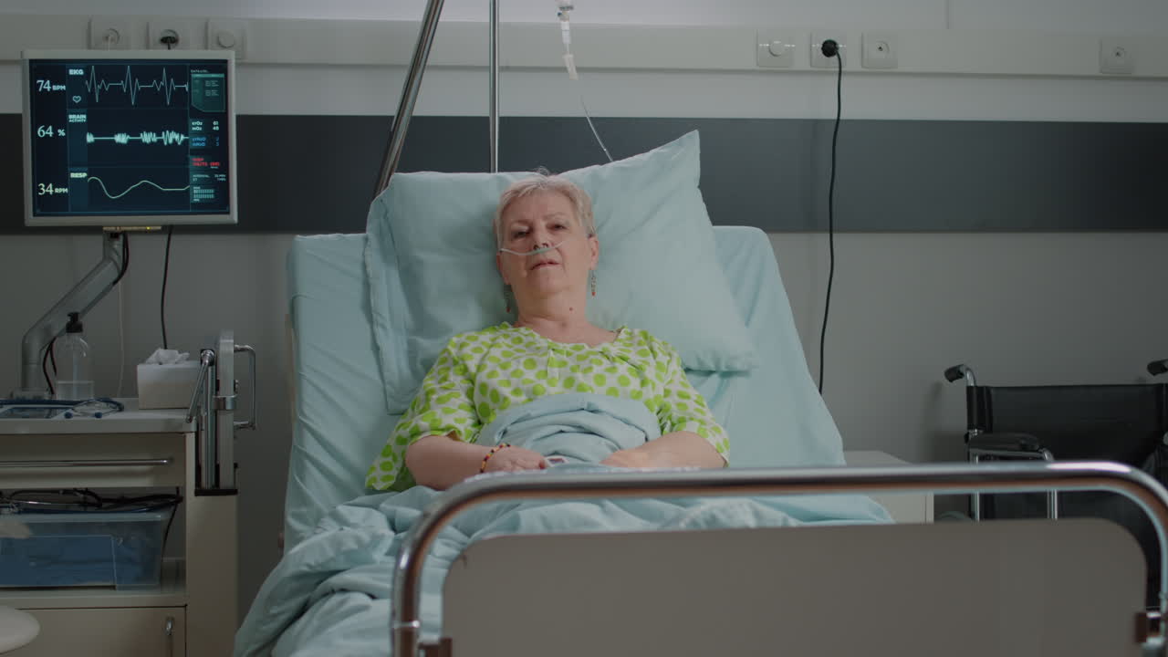 Portrait of old woman sitting in hospital ward bed to cure disease