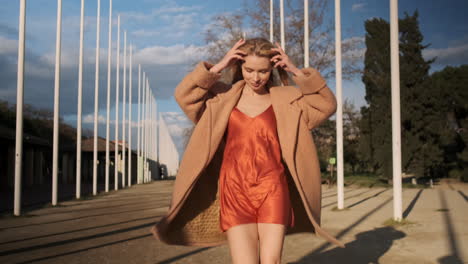 young woman walking outdoors.