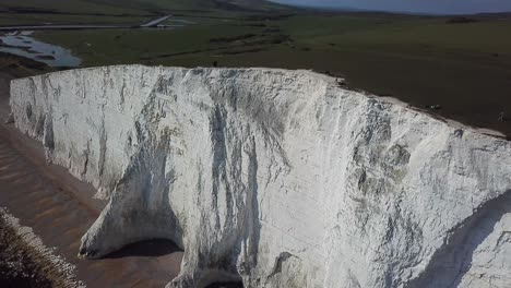 aerial: tall white chalk cliffs, seven sisters east sussex, england