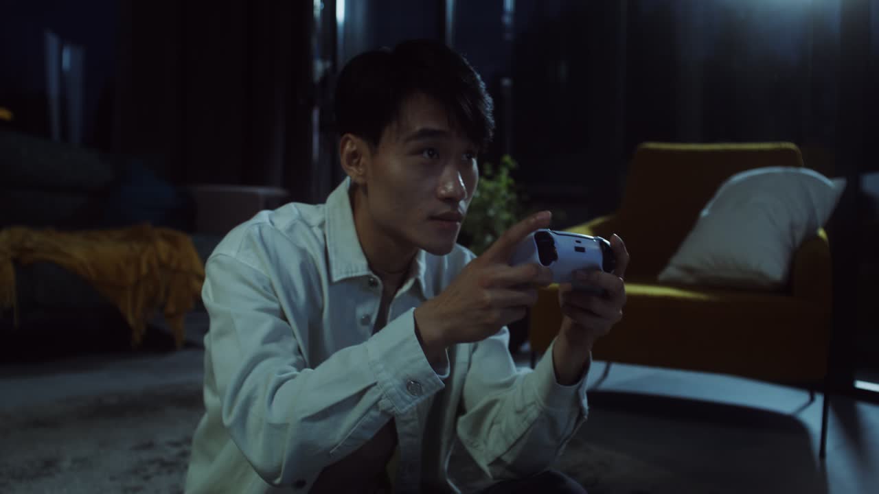 Man Playing Video Games in the Evening