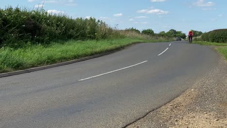 road with cyclist and car