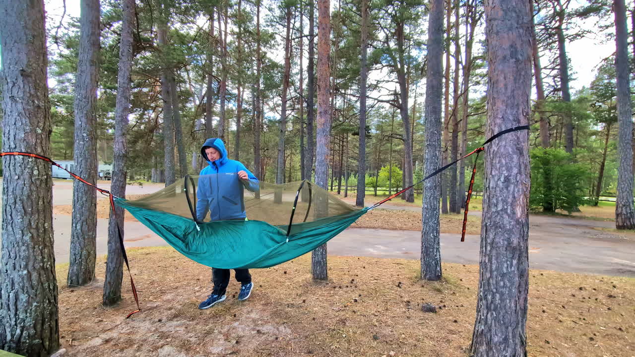Outdoor camping hammock nature survival technique woodland preparation for sleep