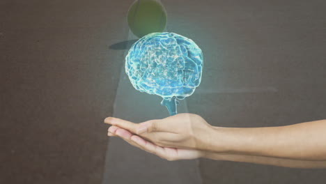 holding glowing brain hologram, hand symbolizing innovation and animation technology