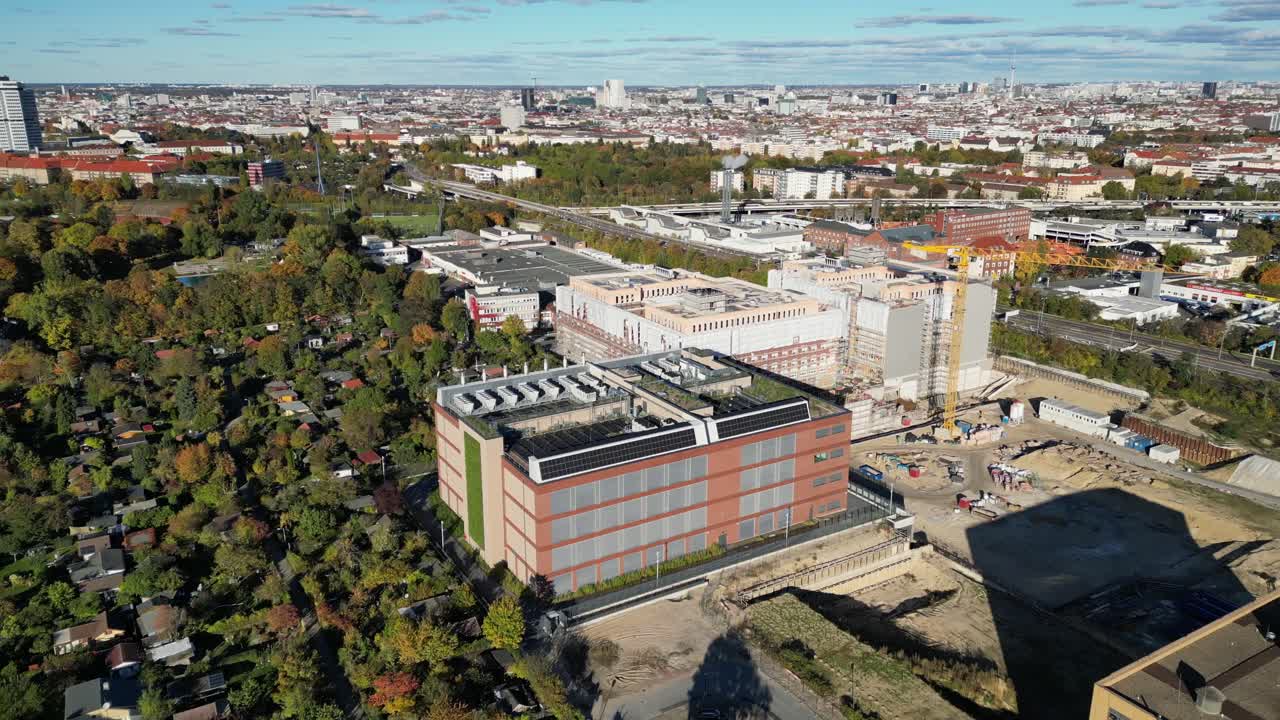 biggest data center building providing cloud computing services in an urban city. blockchain digital database, internet security for sensitive data. Nice aerial view flight pull in drone