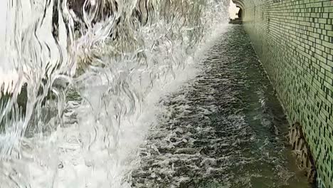 close-up or fountain water drops to small pool in the city