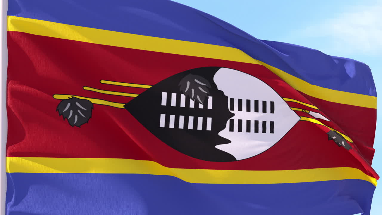 Bandiera dell'Eswatini che sventola al vento contro il cielo blu
