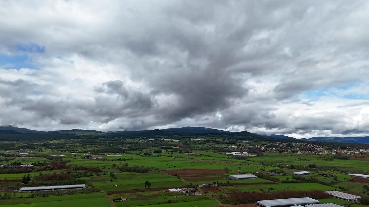 Aerial Hyperlapse of Green Fields and Mountains in Mexico