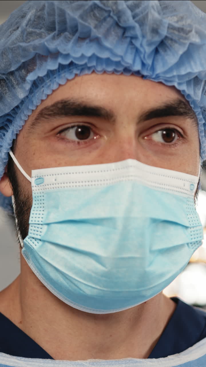 Surgeon in mask vertical video