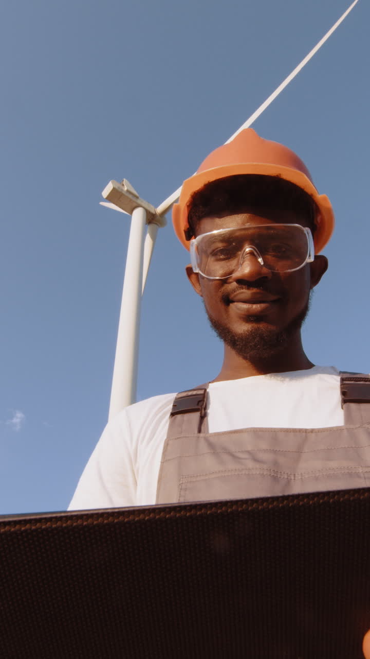 Engineer inspecting wind turbine