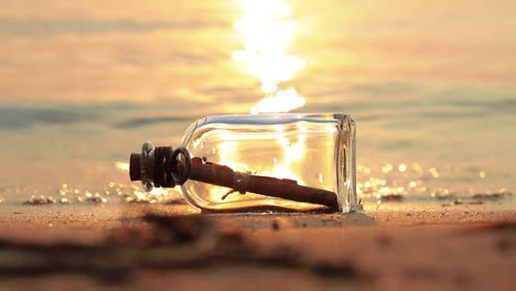 Message-in-a-bottle-on-the-coast-at-sunset.-Message-concepts.