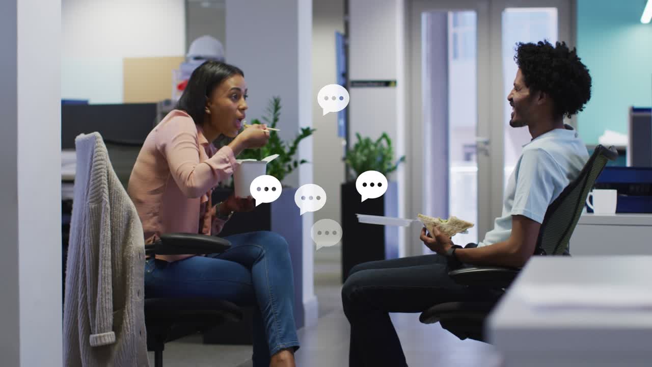 Animation of speech bubbles over diverse business people eating
