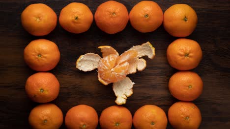 stop motion peel the tangerine and divide into slices.