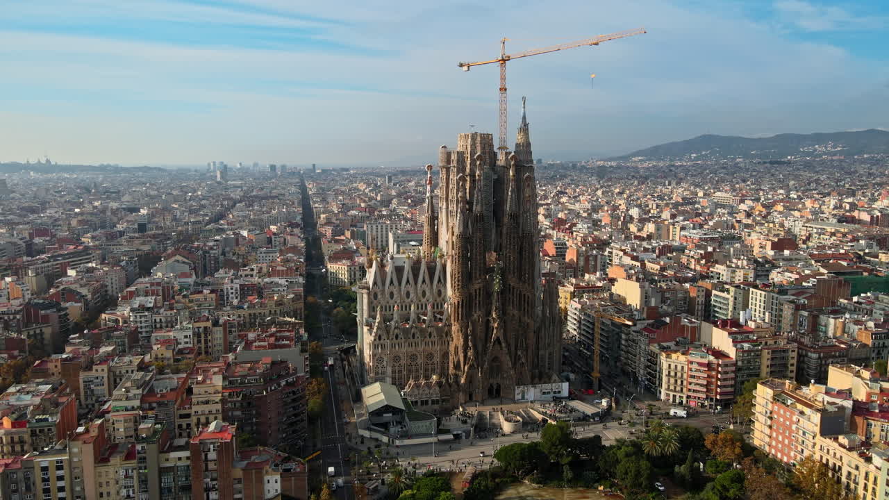 Aerial drone view of Barcelona, Spain. Blocks with multiple residential buildings and Sagrada Familia