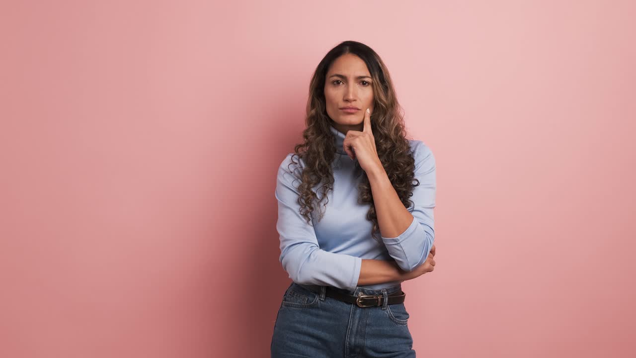 Hispanic woman looking around with thoughtful expression