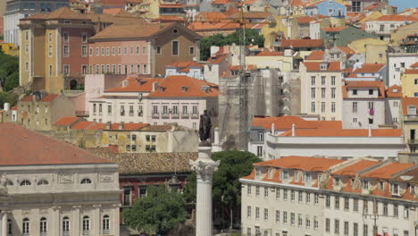 lisbon cityscape with houses and d pedro iv statue portugal