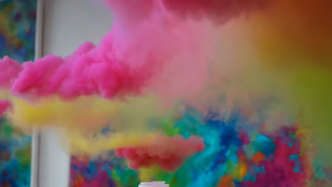 colorful smoke display against abstract art