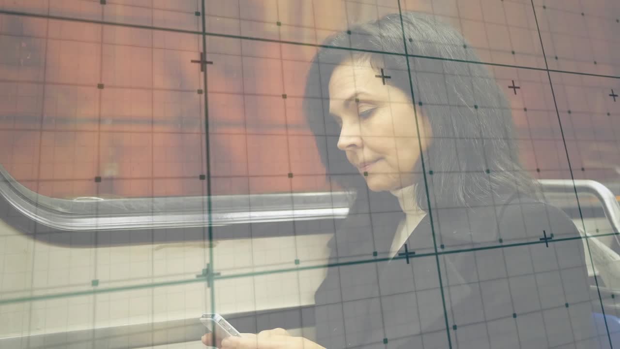 Mature woman using smartphone communication displaying chat bubbles while watching train window