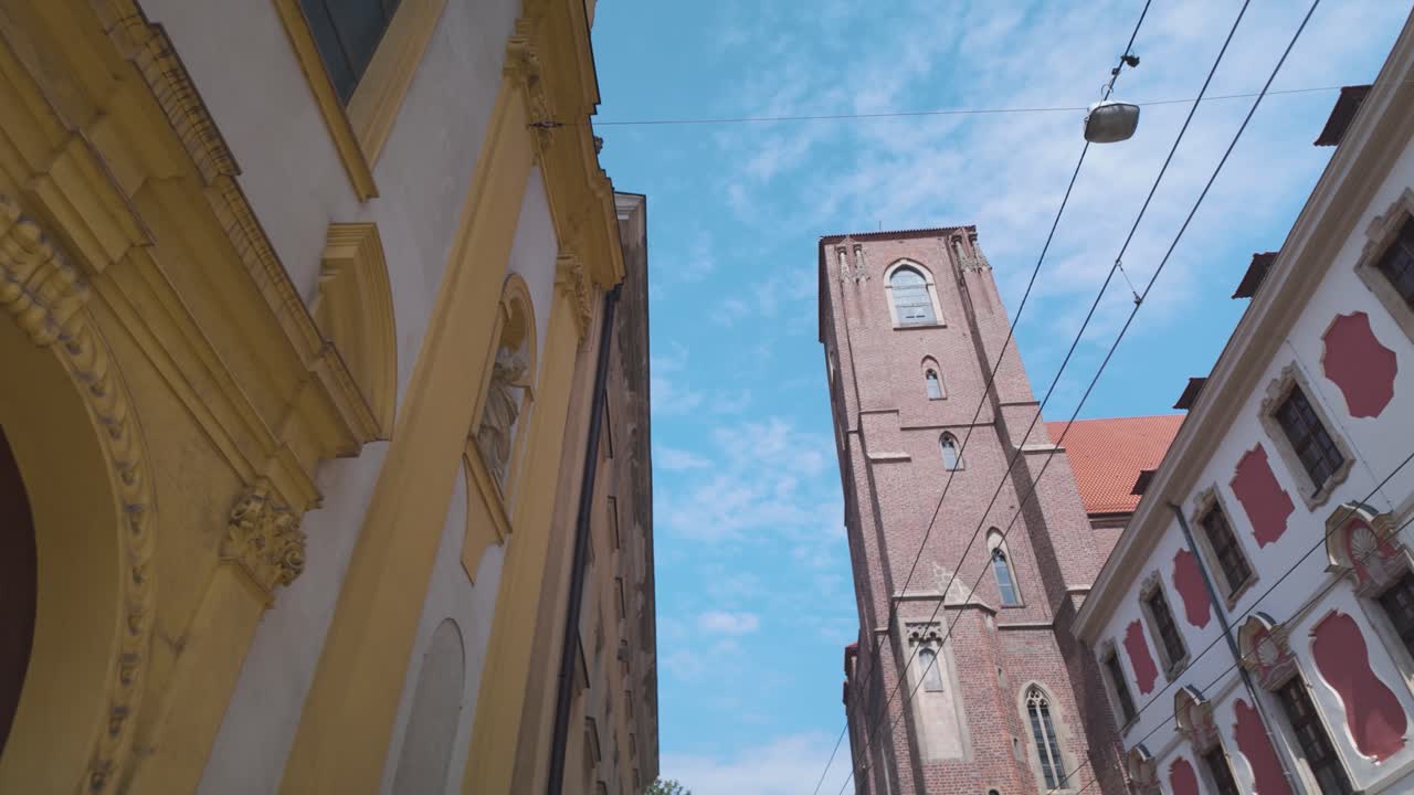 Facade of the historic Church of Our Lady on the Sand And Sts. Cyril and Methodius Church in Wroclaw, Poland, showcasing intricate architectural details against a clear blue sky.