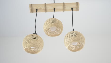 rustic rattan and bamboo chandelier with three pendant lights