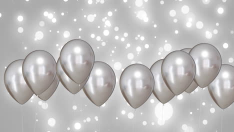 animation of silver balloons over silver and white background