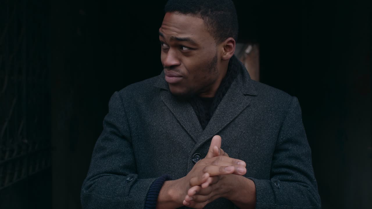 A Man's Pensive Expression in a City Setting