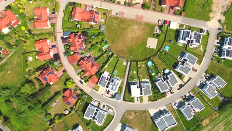 Aerial-view-of-residential-houses-neighborhood-and-apartment-building-complex-at-sunset