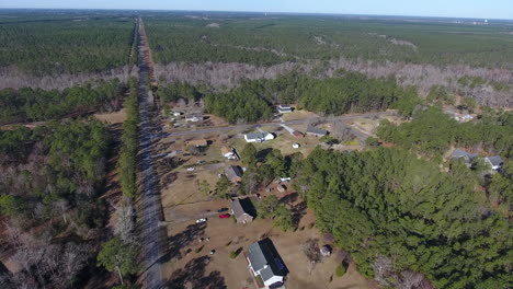 drone shot moving toward back road intersection in north carolina