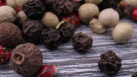 macro close-up mixed peppercorns. dry mix peppercorns close up