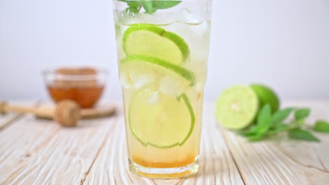 iced honey and lime soda with mint - refreshing drink