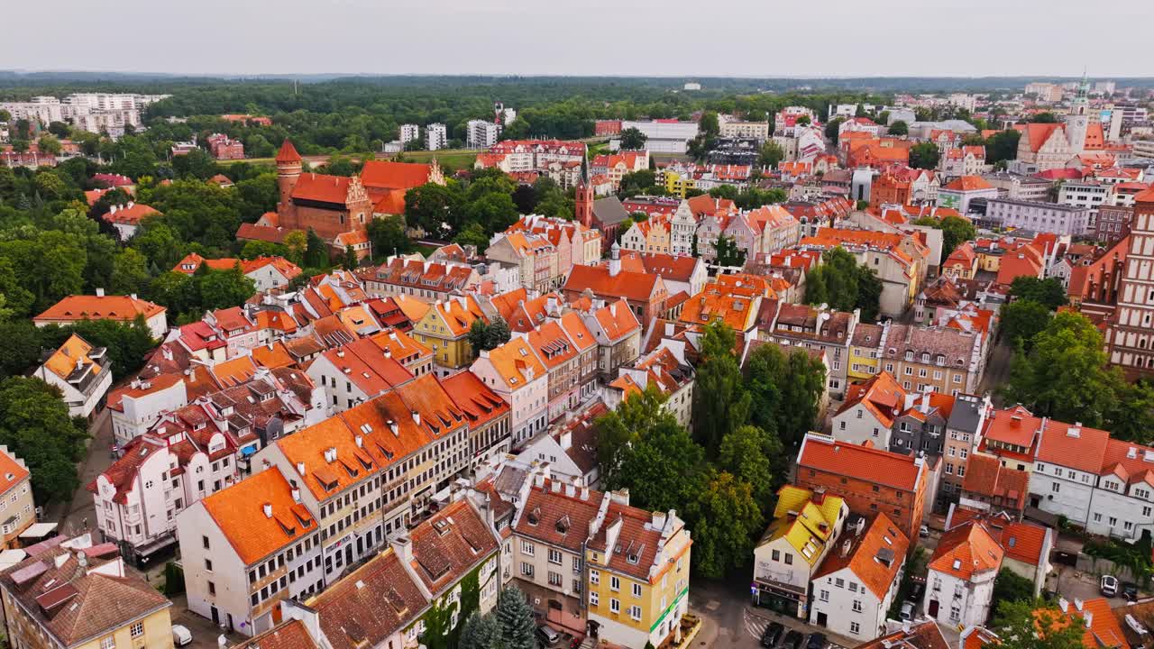 Drone orbiting and ascending to reveal panoramic view of Olsztyn Old Town