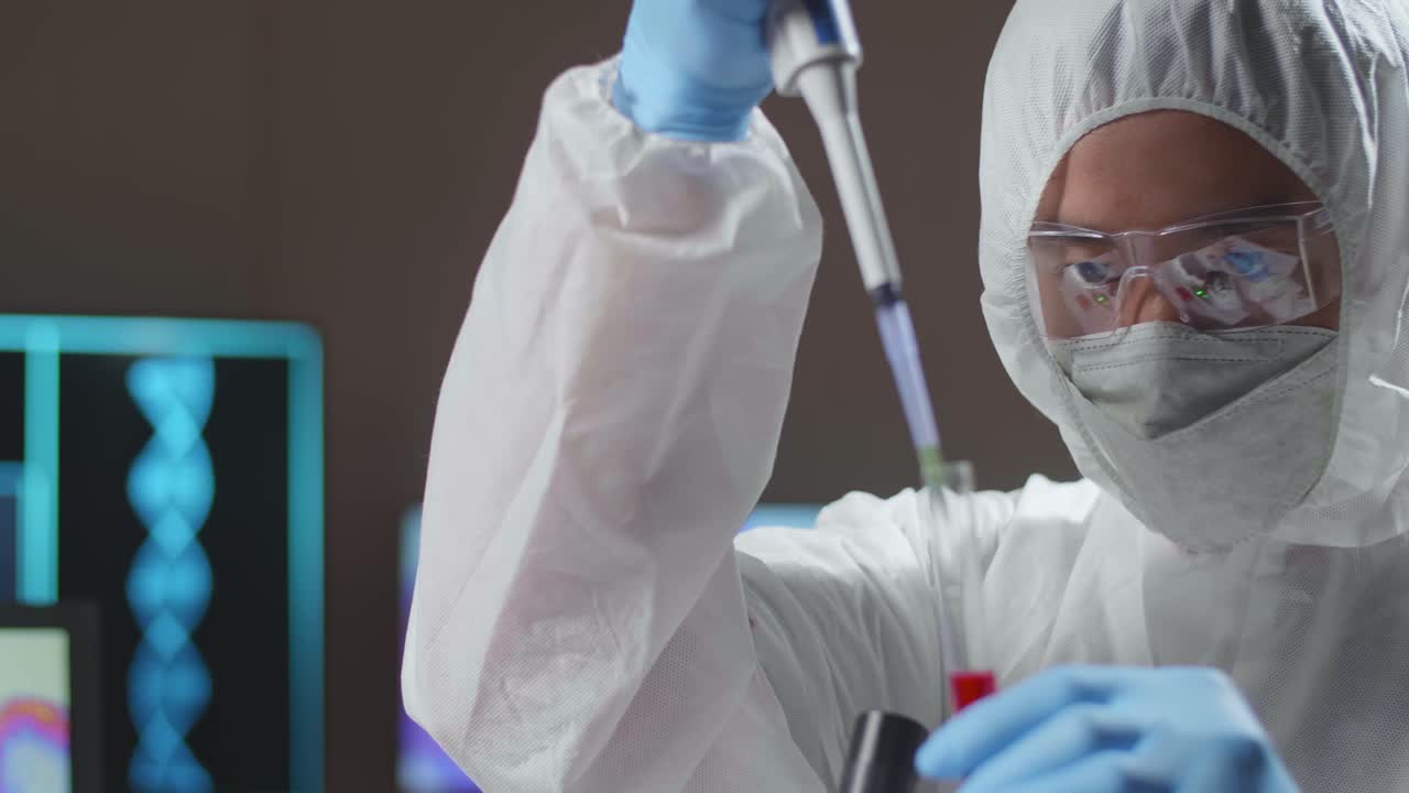 Doctor In Protective Suit Is Doing A Science Experiments And Developing Vaccine In A Modern Lab. Laboratory Assistant Workplace. The Concept Of Science And Medicine