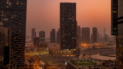 abu dhabi's skyline in a sunset to nighttime time lapse as seen from al reem island above al 'oud steet