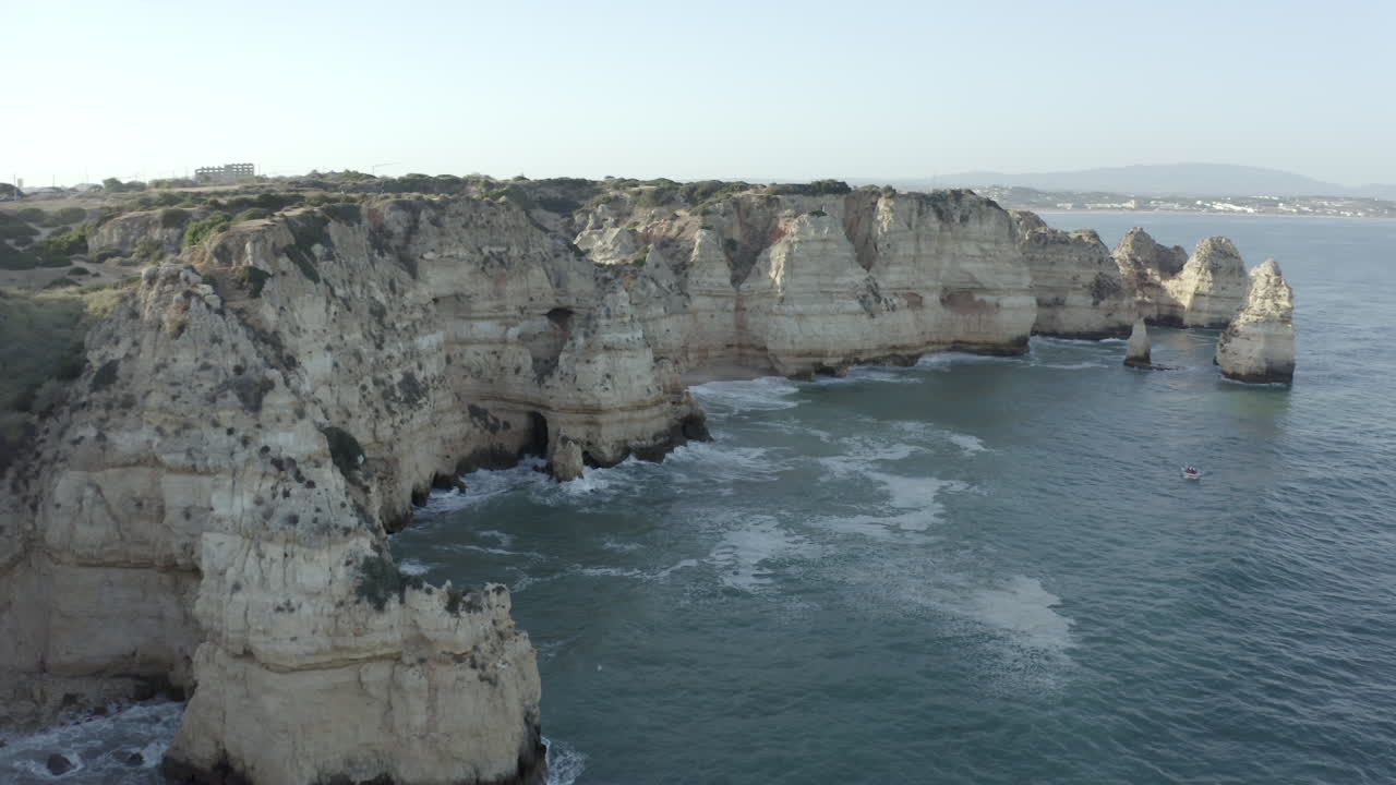 Stunning Aerial View of Dramatic Cliffs and Coastline in Algarve, Portugal