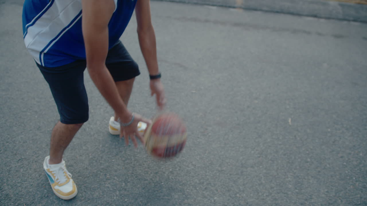 Young Basketball Player Dribbling on Outdoor Court