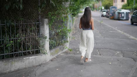 woman walking down a city street