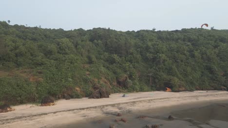 Drone-Captures-Paraglider-Soaring-Above-Beach-in-Goa-India