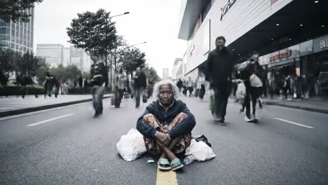 an elderly woman is seated on a busy street, surrounded by moving pedestrians. she appears contemplative amid the rush of city life, symbolizing solitude and resilience.