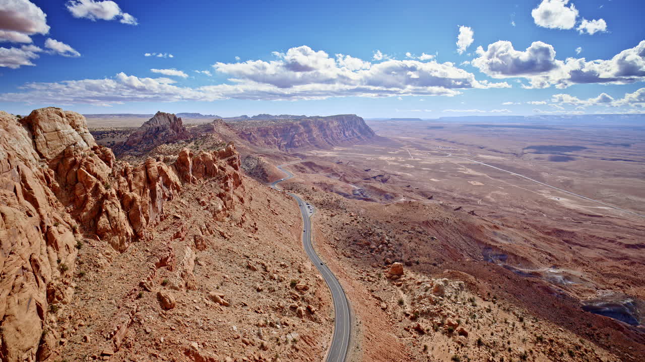 Jaw-dropping aerial perspective flying tight along the mountain's edge, showcasing the dramatic elevation shift near Antelope Pass Vista.