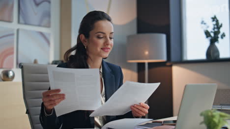 Office woman working papers at light workspace closeup. Manager study documents