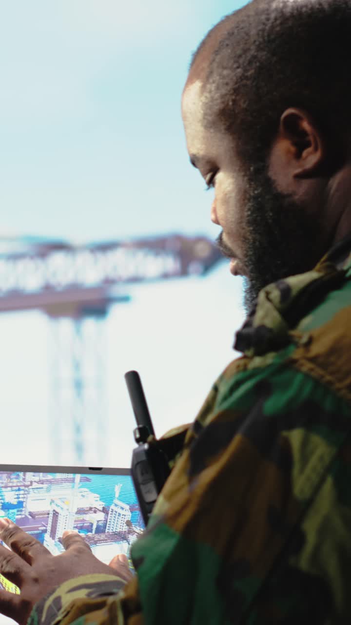 Vertical video Naval unit on drilling rig barge using tablet, safeguarding infrastructure