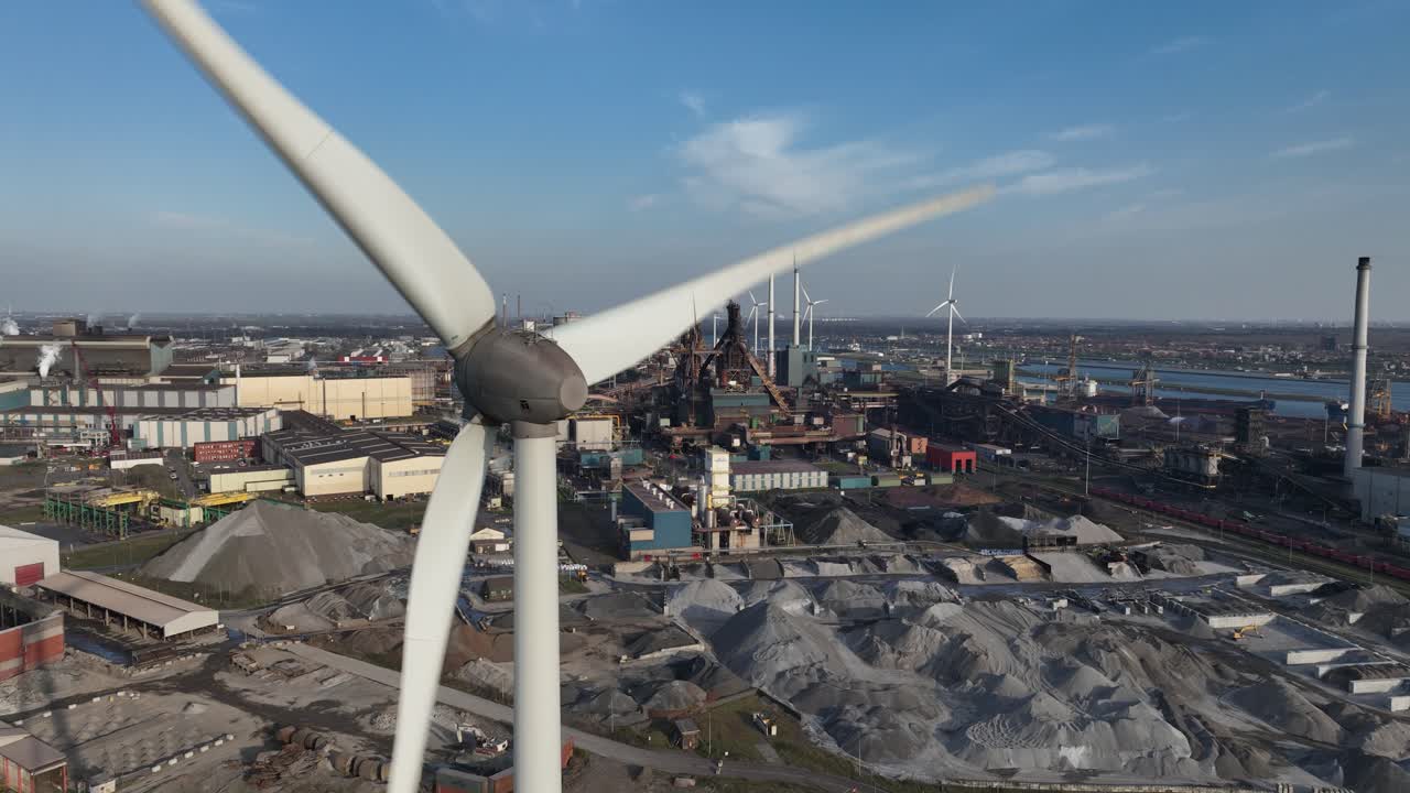 Wind turbines Ijmuiden Steel factory, Sea sluice, lock complex, Blast furnace, industrial zone along the North Sea. Aerial view. Renewable energy.