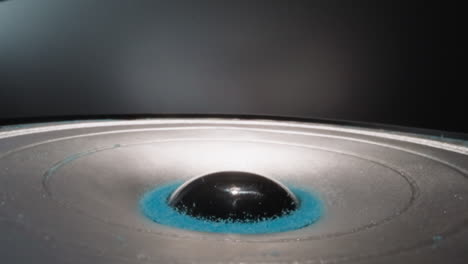 blue powder granules move lying near dust cap on dynamic