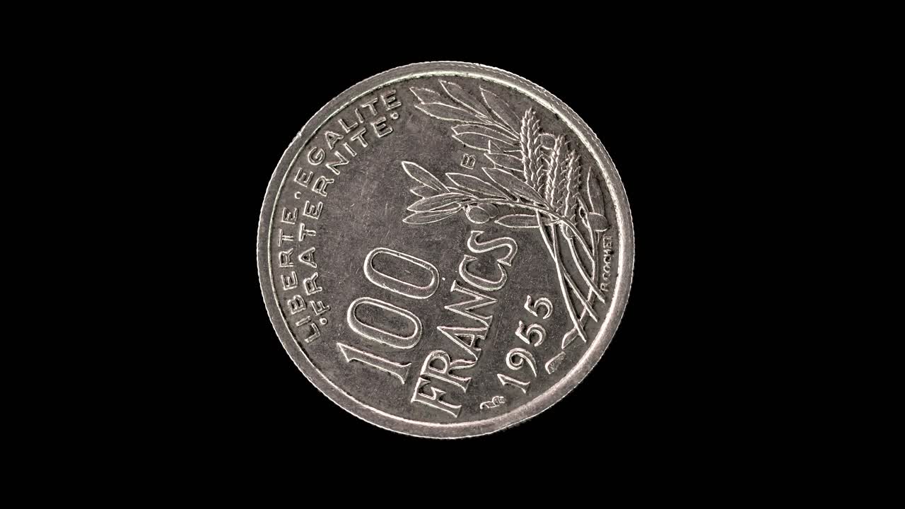 France 1955 100 francs coin reverse with fruit, wheat and olive branches rotating on black background
