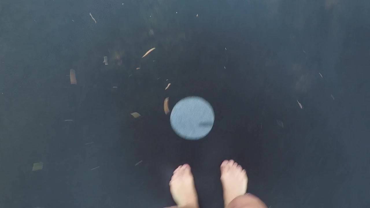 Girl Jumping the trampoline.