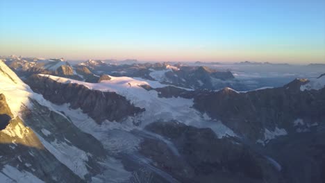 Wide-high-altitude-aerial-view-from-drone-over-Alps-on-border-of-Switzerland-and-Italy-near-Matterhorn