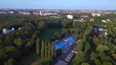 unbelievable aerial top view flight berlin city public swimming pool germany in europe, summer day 2023