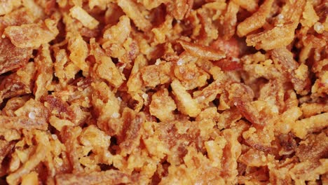 Traditional fried crispy onions backed in flour close-up macro. Dried onion topping. Fast food.Snacks. High quality 4k footage