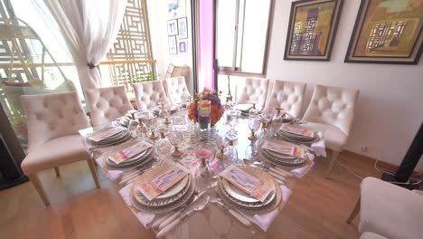 backward movement shot of a luxurious dining table in the dining room